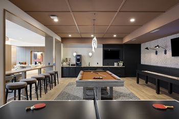 Game room with billiards and shuffleboard